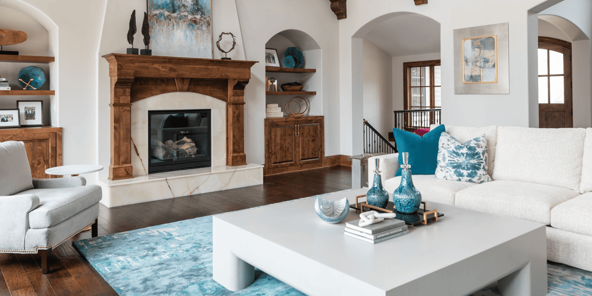 Great Room Renovation with Arched Doorways and Large Fireplace