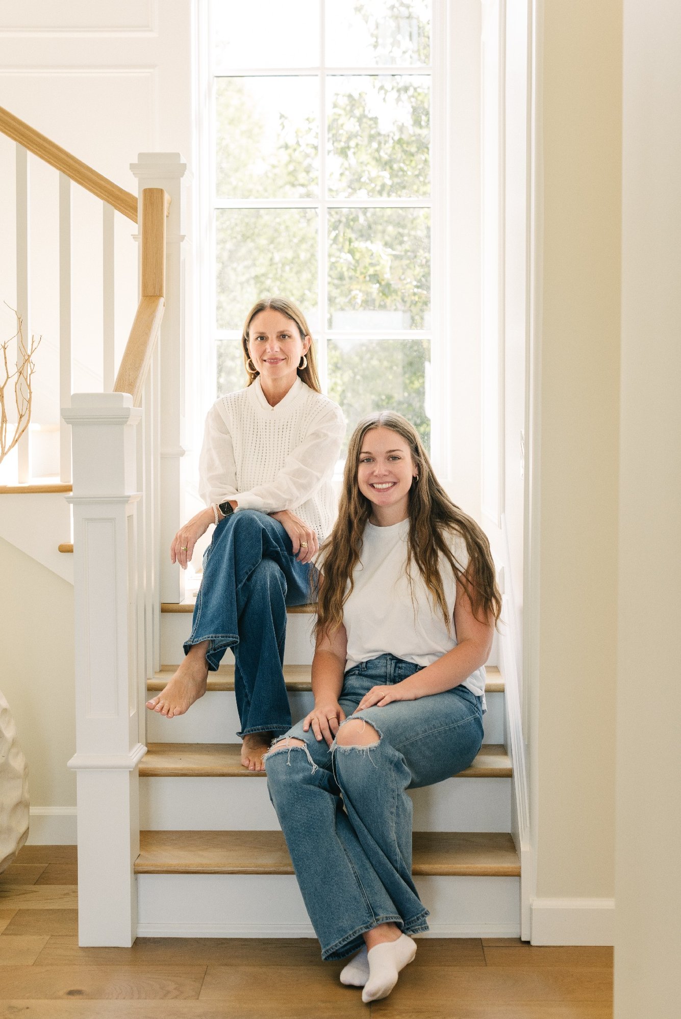 Payne and Tompkins Designers Sitting on Stairs to Second Floor Of Pool House