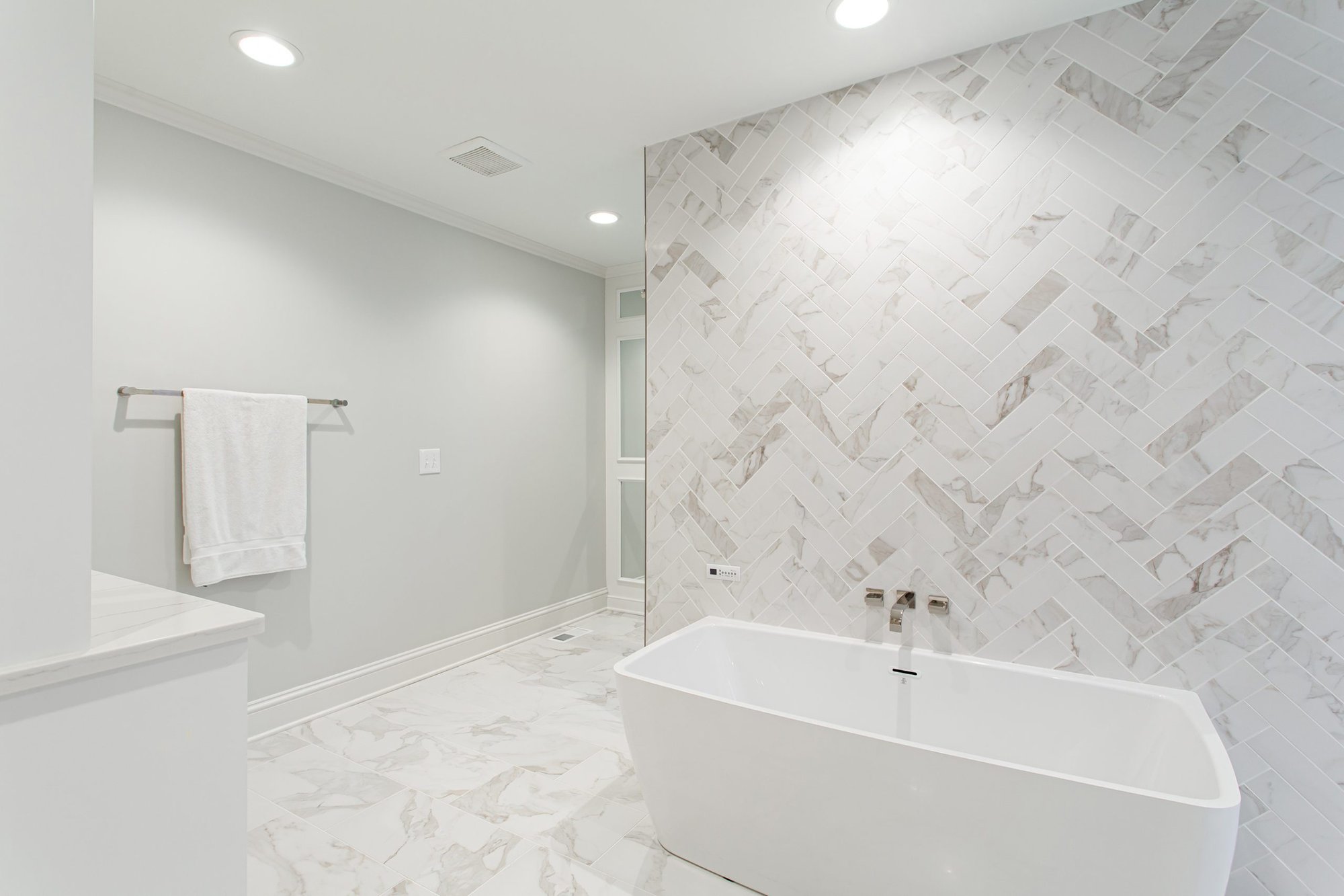 White Bathroom with Herringbone Feature Wall