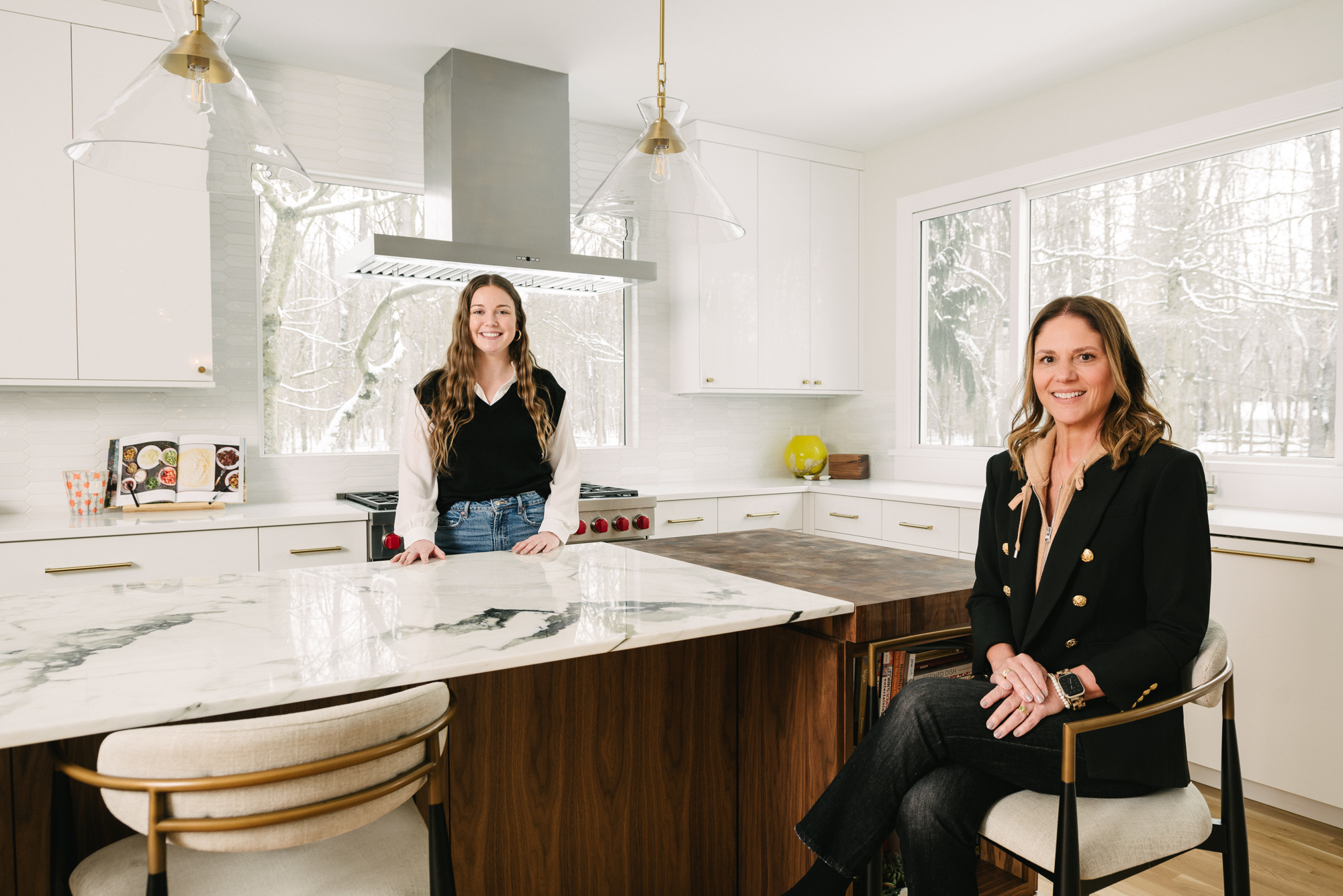 Team in a Kitchen Remodel with Glass Pendant Lights Over the Modern Island in Cleveland